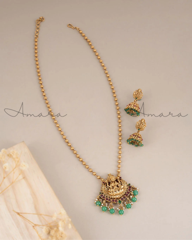 Long haaram with Laxmi pendant Length end to end 50cm + chain extender and jhumki earring. Earring length 4cm AM2UF11H