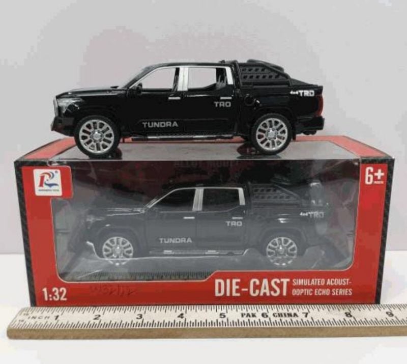 1:32 scale die-cast model of a black Toyota Tundra TRD 4x4 pickup truck (W32112)