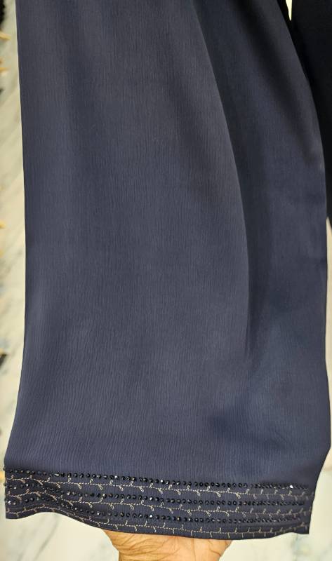 Elegance redefined:The Blue Bliss Abaya with fleet and stone embroidery
