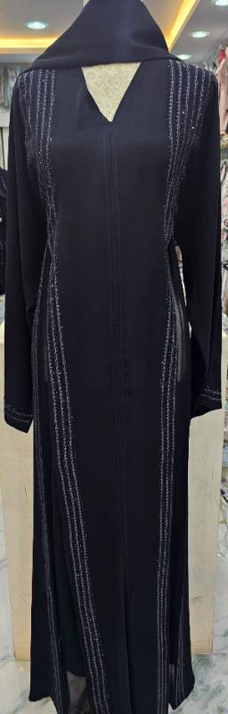 Step into the Night with Our Stunning Black Abaya