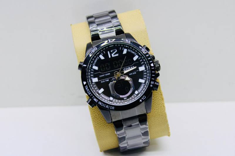 Coral Astral: The Perfect Accessory for the Fashionable Man

Elevate your style with the Coral Astral Gents Metal Dual Time Watch, a masterpiece of modern horology. This sleek timepiece boasts a stainless steel band and a black face with white and blue accents, exuding sophistication and elegance.

Key Features:

- Dual Time Functionality: Keep track of time in two different zones with ease.
- Stainless Steel Band: Durable and resistant to corrosion, ensuring a long-lasting wear.
- Black Face with White and Blue Accents: A classic design with a touch of modernity.
- Water Resistance: With a water resistance of 30 meters, you can wear it with confidence in various conditions.

Perfect for:

- The modern man who values style and functionality.
- Business professionals who need to keep track of time across different time zones.
- Individuals who appreciate the finer details in watchmaking.

Make a statement with the Coral Astral Gents Metal Dual Time Watch. Order yours today!