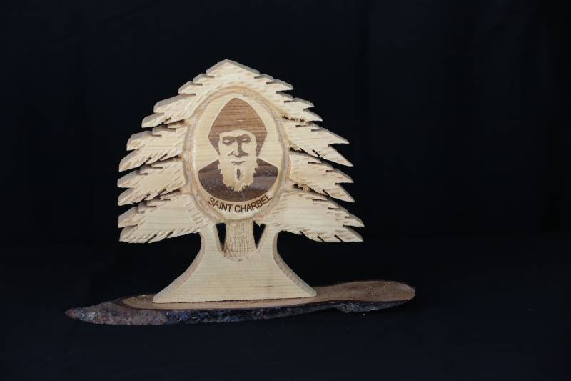 Wooden Statue of Saint Charbel with Cedar Tree Design
تمثال خشبي للقديس شربل بتصميم أرز لبنان