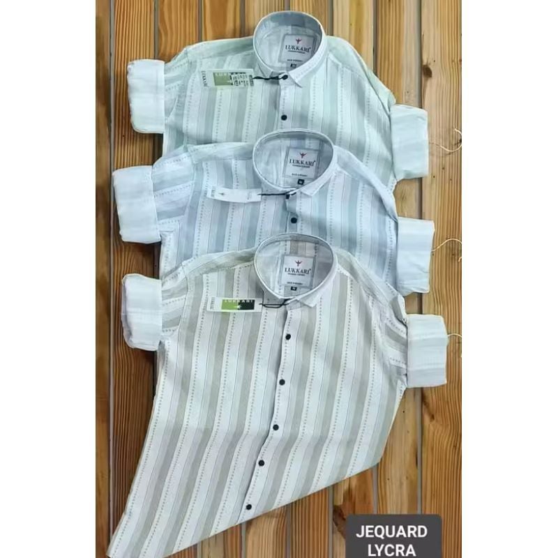 The top shirt is a light mint green with white or very light green stripes.1 Pake 3 Shirt