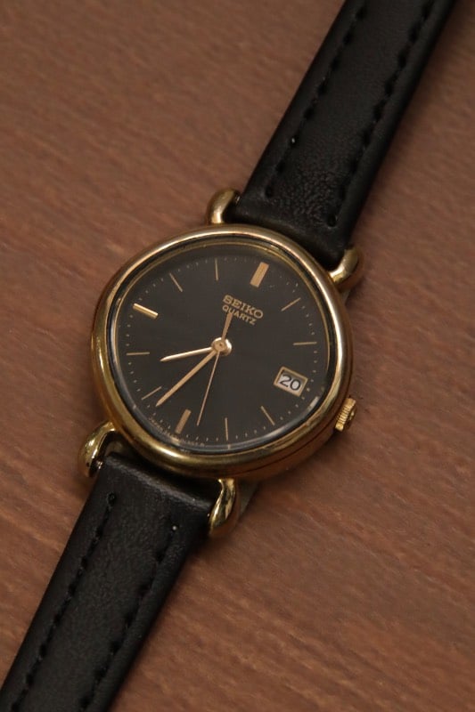 Seiko Black Dial Gold Case Oval Watch With Date Indicator
