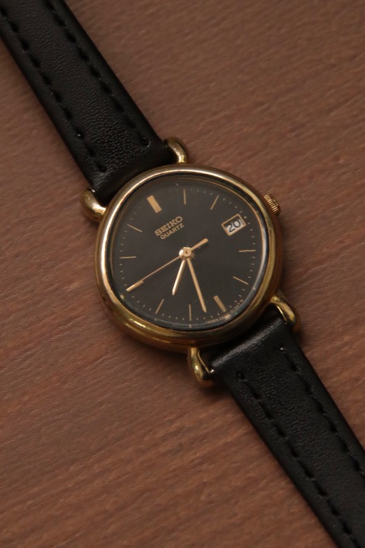 Seiko Black Dial Gold Case Oval Watch With Date Indicator