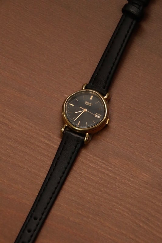Seiko Black Dial Gold Case Oval Watch With Date Indicator