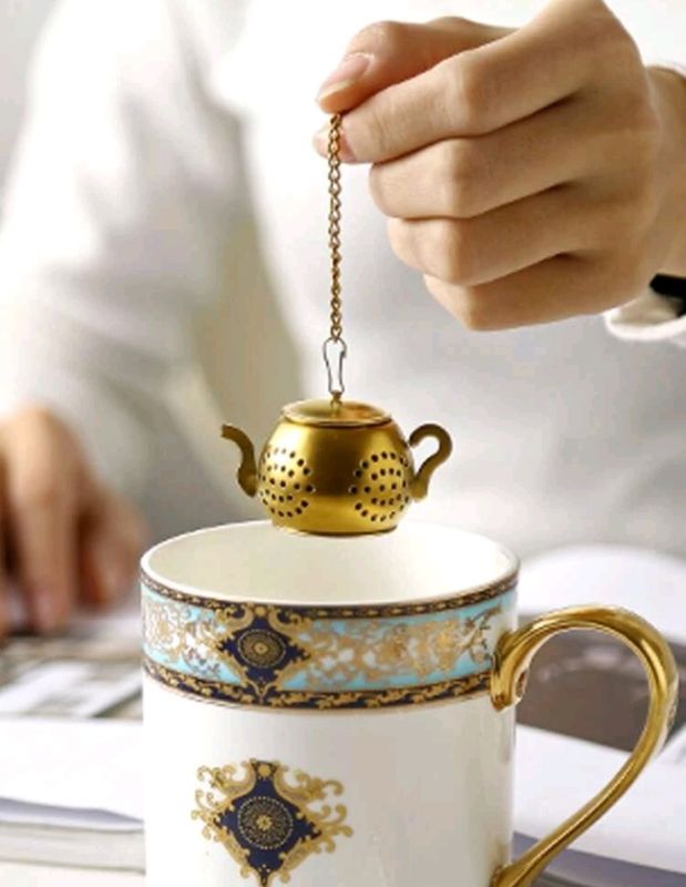 Colador de té de acero inoxidable con diseño de tetera