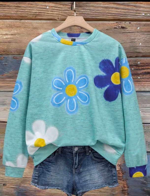 Blusa de mangas largas con diseño de flores
