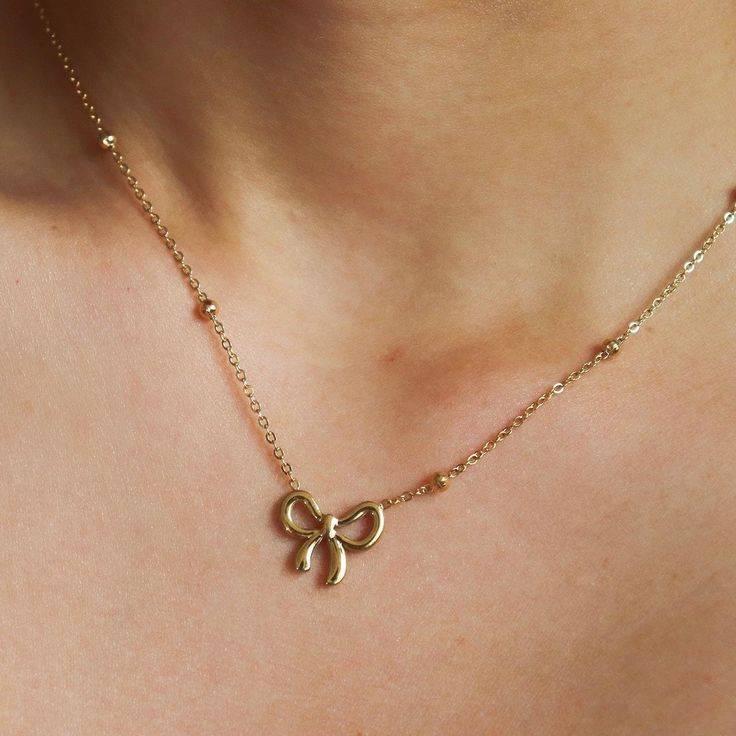 Infinity bow pendant