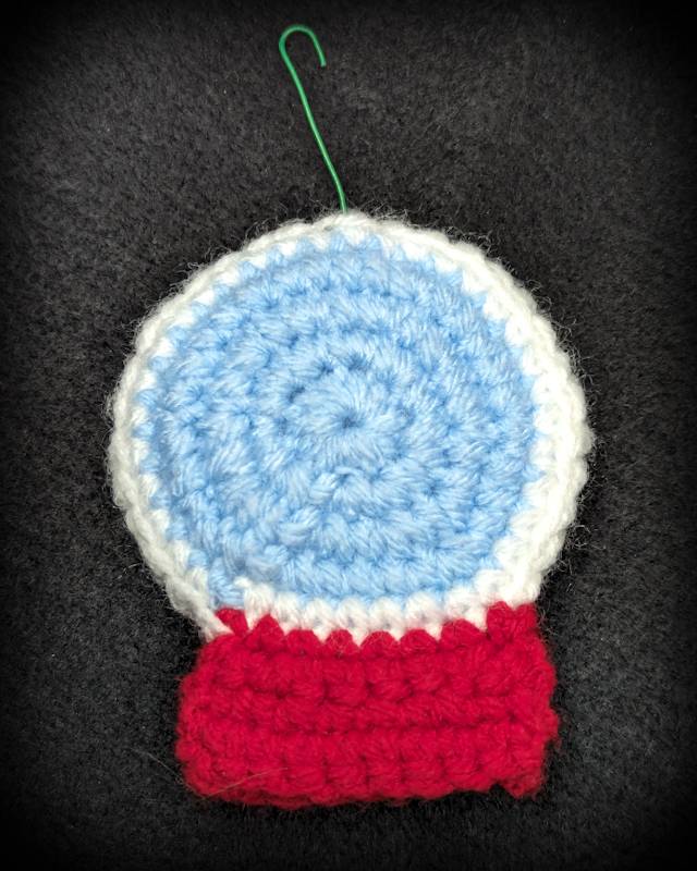 Crochet Snowglobe Ornament (F) - Red base: Green/Red Xmas Wreath and Kawaii Snowman with 2 snowflakes icons in Globe