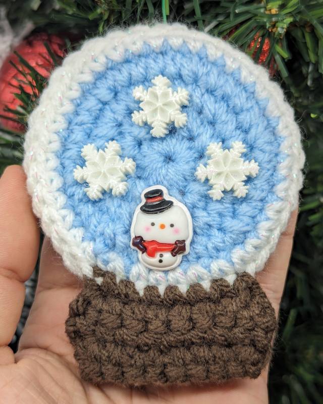 Crochet Snowglobe Ornament (B) - Brown base: Kawaii Snowman with 3 White Snowflake icons in Globe