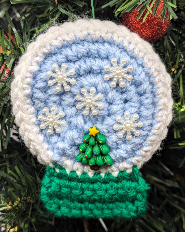 Crochet Snowglobe Ornament (C) - Green base: Green Xmas Tree Icon with 5 Snowflake icons in Globe