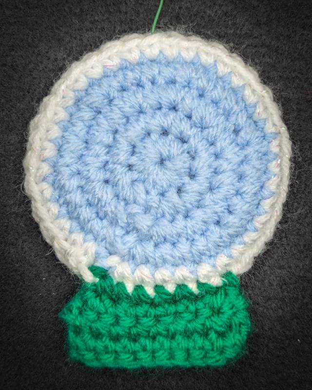 Crochet Snowglobe Ornament (C) - Green base: Green Xmas Tree Icon with 5 Snowflake icons in Globe