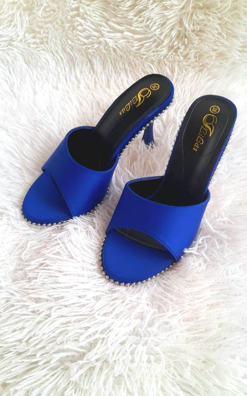 Blue high-heeled mules.