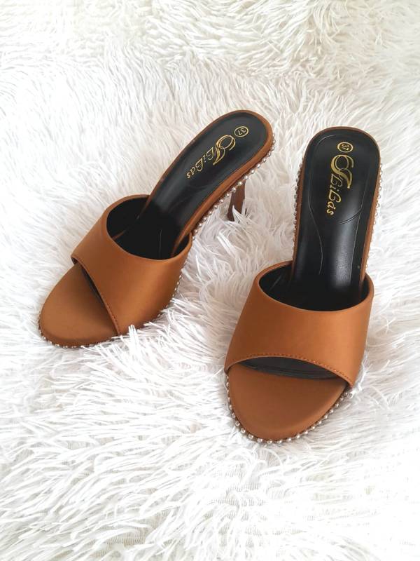 Brown high-heeled mules.