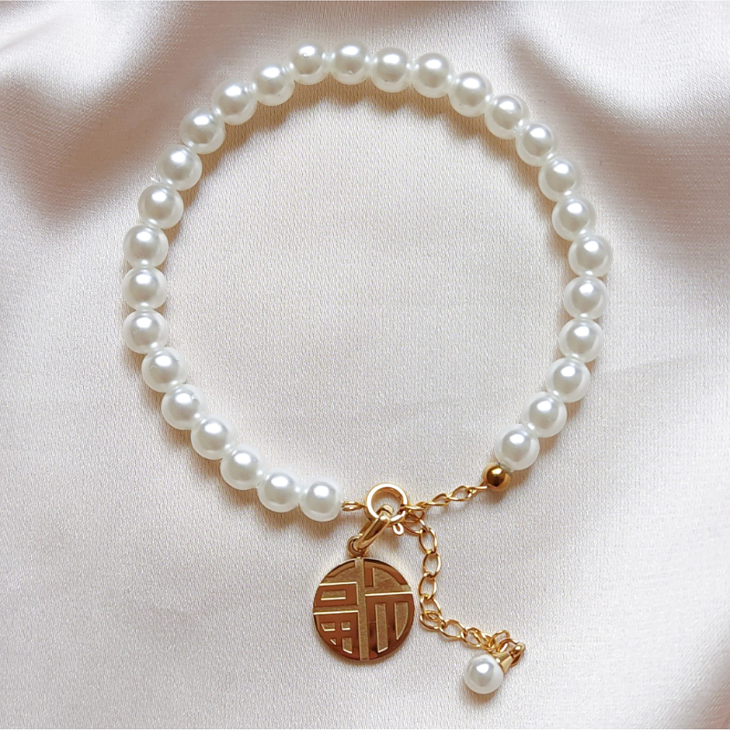 Pulsera Perlas acrílicas y acero inoxidable