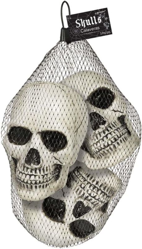 bag ofskeleton heads standing and hanging