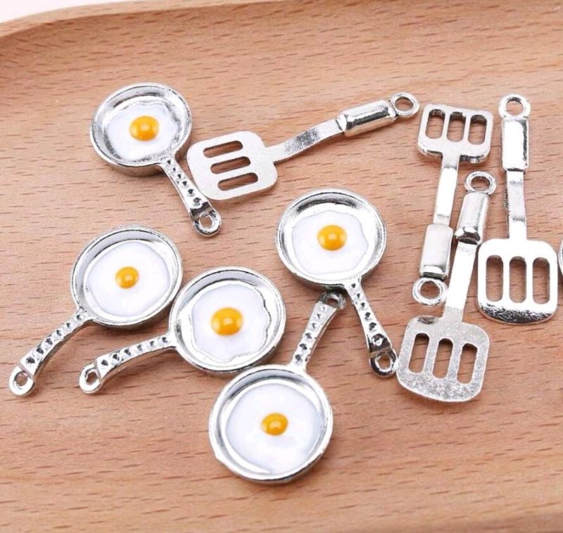 egg in frying pan with spoon