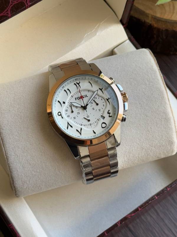 This Fossil watch exudes elegance with its sleek stainless steel design, unique Arabic numeral styling, and sophisticated chronograph functionality.