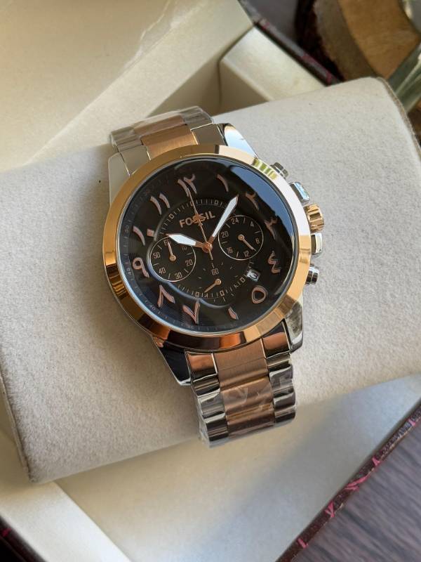This Fossil watch exudes elegance with its sleek stainless steel design, unique Arabic numeral styling, and sophisticated chronograph functionality.