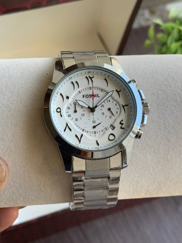 This Fossil watch exudes elegance with its sleek stainless steel design, unique Arabic numeral styling, and sophisticated chronograph functionality.